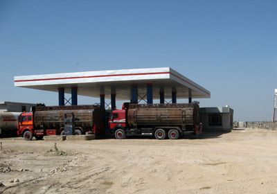Part of a vast herd of tankers. Transhipping oil off trains fro, Friendship Bridge, Afghanistan 2009