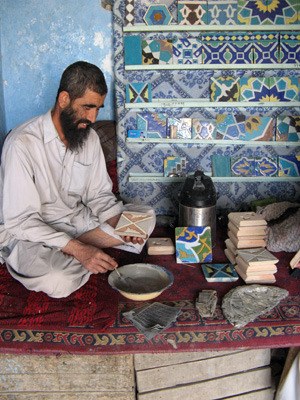 Tile Factory: Applying glazes Note scrap metals in foreground,, Mazar-e Sharif, Afghanistan 2009