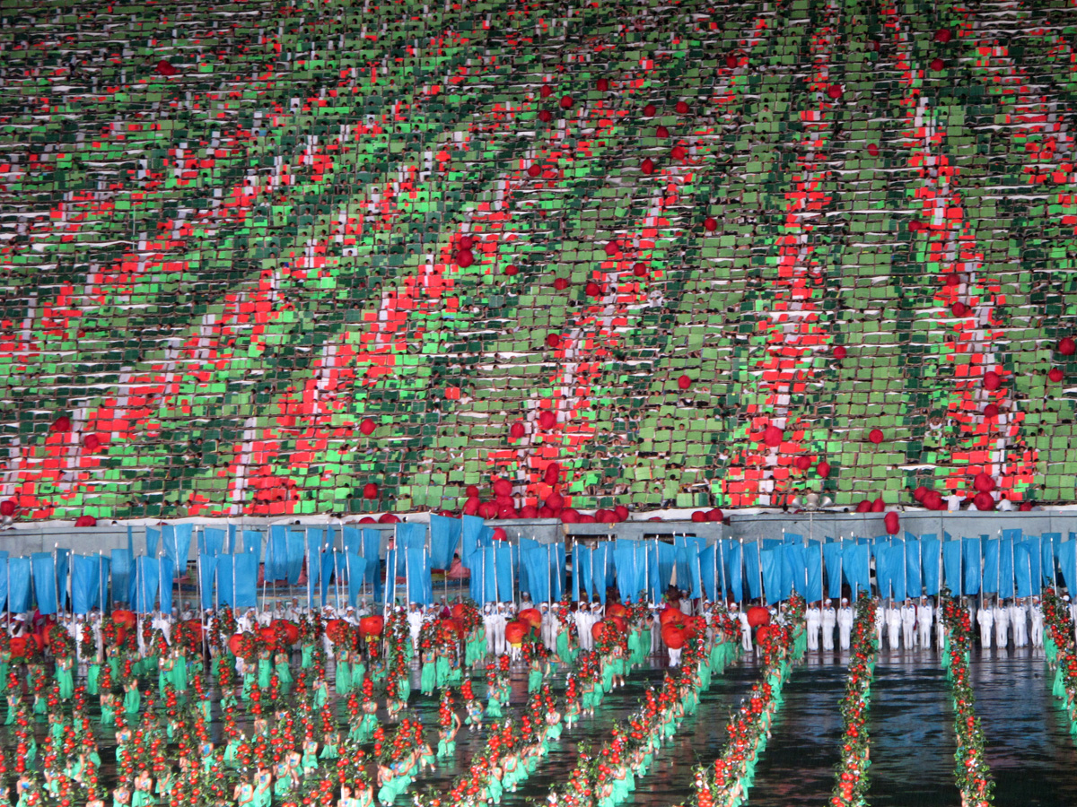 North Korea - Mass Games, Tomatoes(?) roll down the flip-card array.