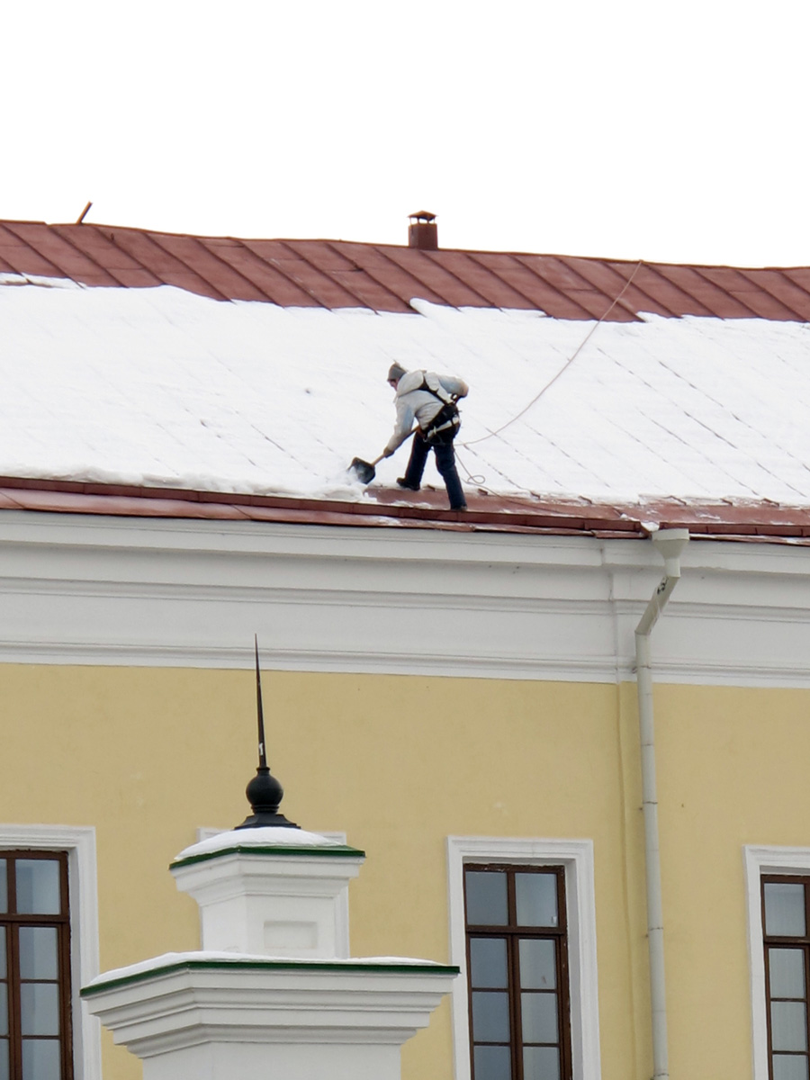 Kazan, Clearing snow off the roof.