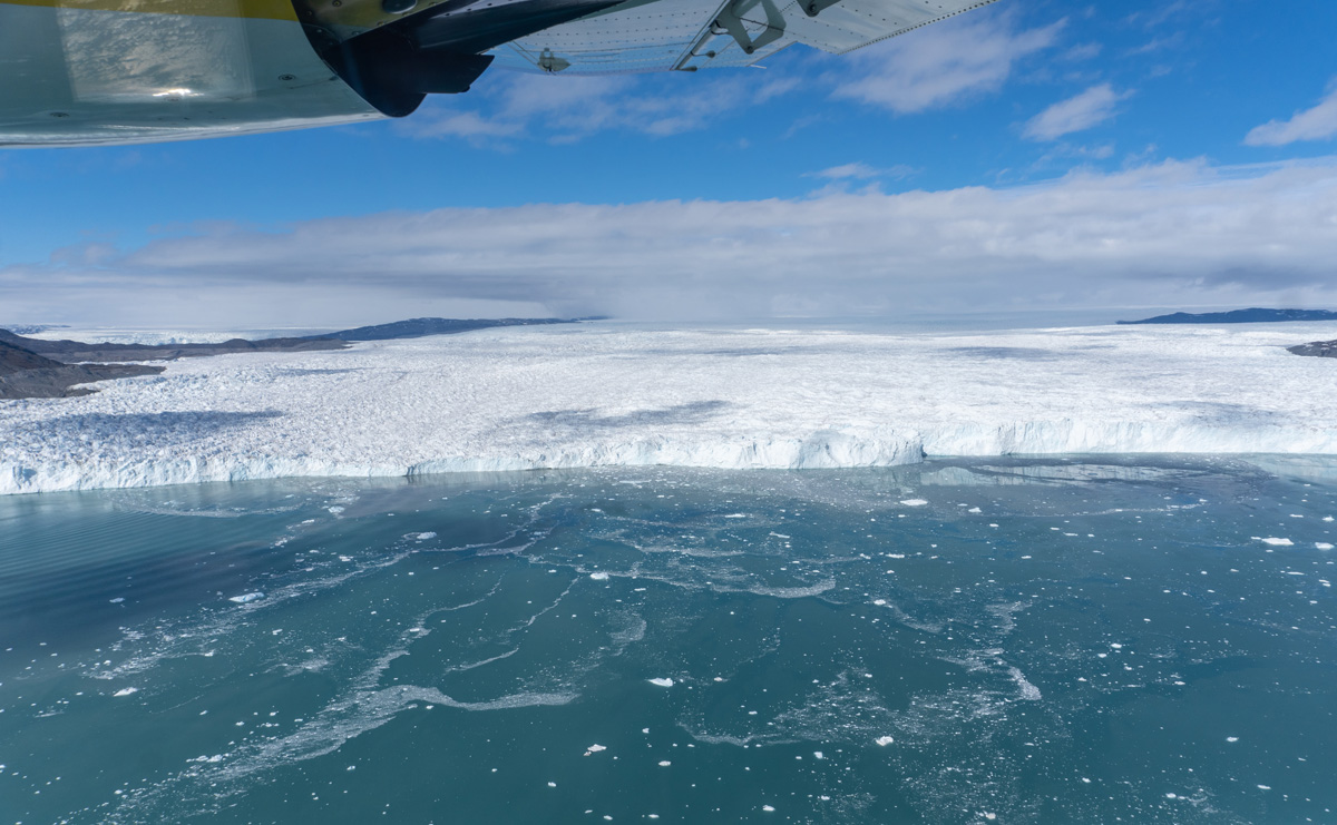 Disko Bay "Master Explorer" Flight, Kangilerngata Sermia face A floating face, so large bergs calve smoothly into the water.