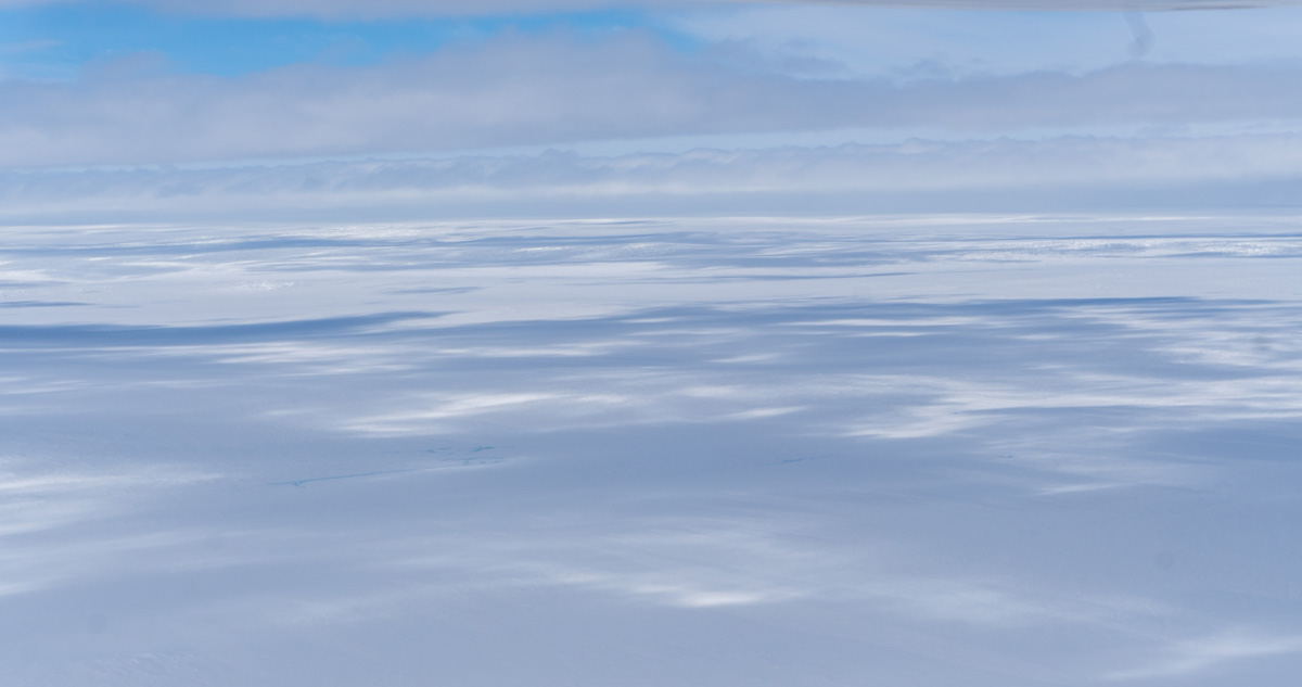 Disko Bay "Master Explorer" Flight, Cloud-shadowed Ice Cap view