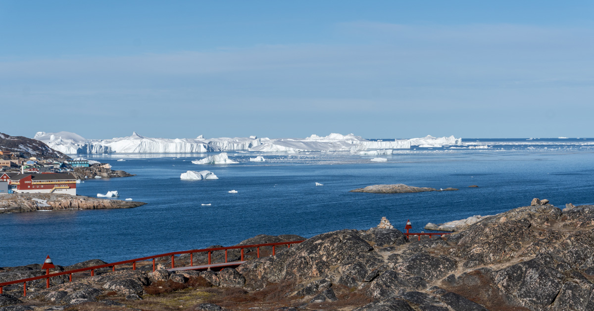 Disko Bay: Around Ilulissat, View to projecting ice at mouth of Icefjord From Hotel Arctic, across Ilulissat harbor