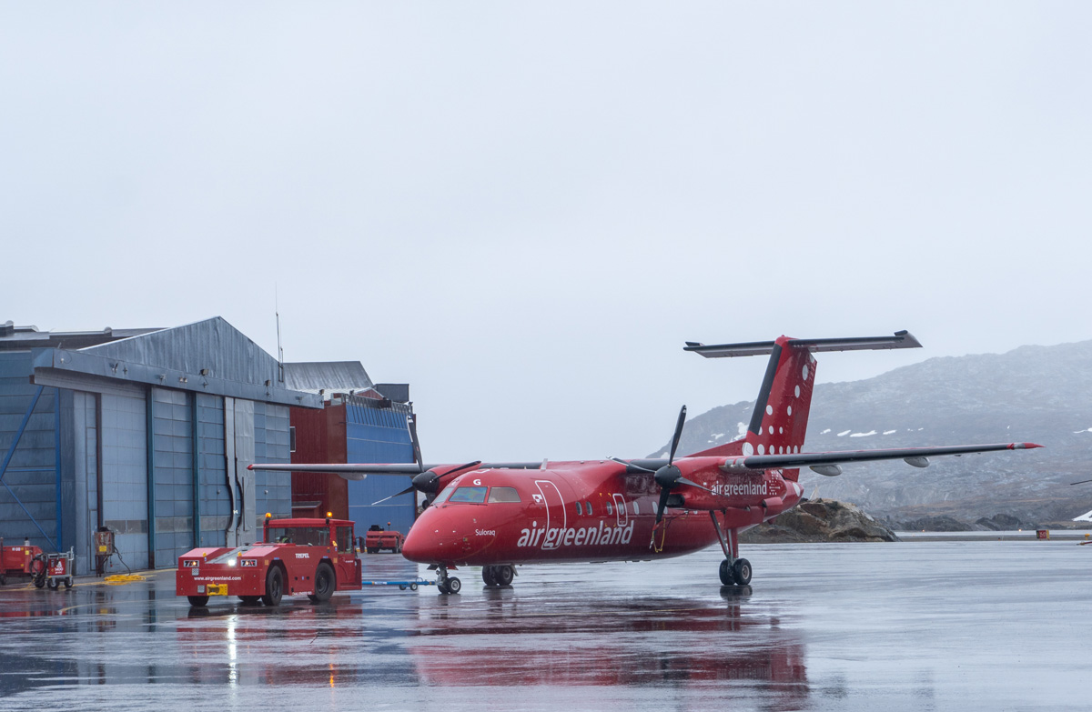 Kangerlussuaq, Air Greenland Dash-8 being hauled off for maintenace An all too common sight, unfortunately.