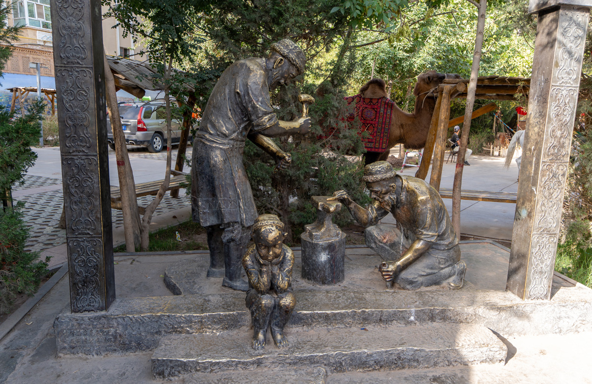 Kashgar, Bronze blacksmiths The bored child is a nice touch