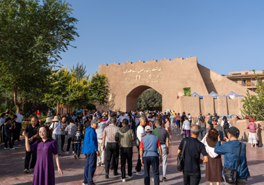 A dense crowd of tourists at the Ancient City Gates, Kashgar, Xinjiang + Kazakhstan, 2023