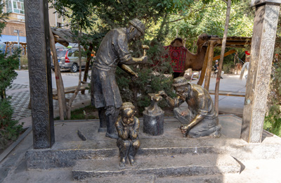 Bronze blacksmiths The bored child is a nice touch, Kashgar, Xinjiang + Kazakhstan, 2023