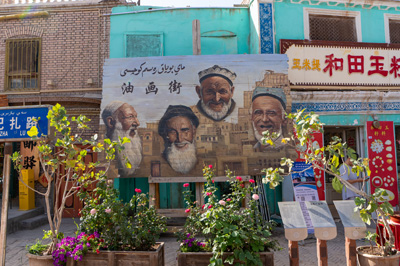 Signboard showing noted local artists Sign says "Oil Paint, Kashgar, Xinjiang + Kazakhstan, 2023