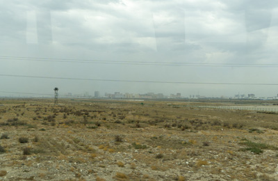 View back to Khorgas, from a bus, Khorgas Border Crossing, Xinjiang + Kazakhstan, 2023