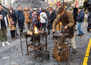 Christmas Market: Blacksmith, Prague: Old Town Square, Czechia, December 2023