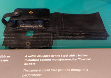 Wallet with camera, Berlin: Stasi HQ Museum, Germany, November 2023
