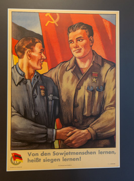 Inspirational DDR+USSR poster "To learn from the Soviet pe, Berlin: Stasi HQ Museum, Germany, November 2023